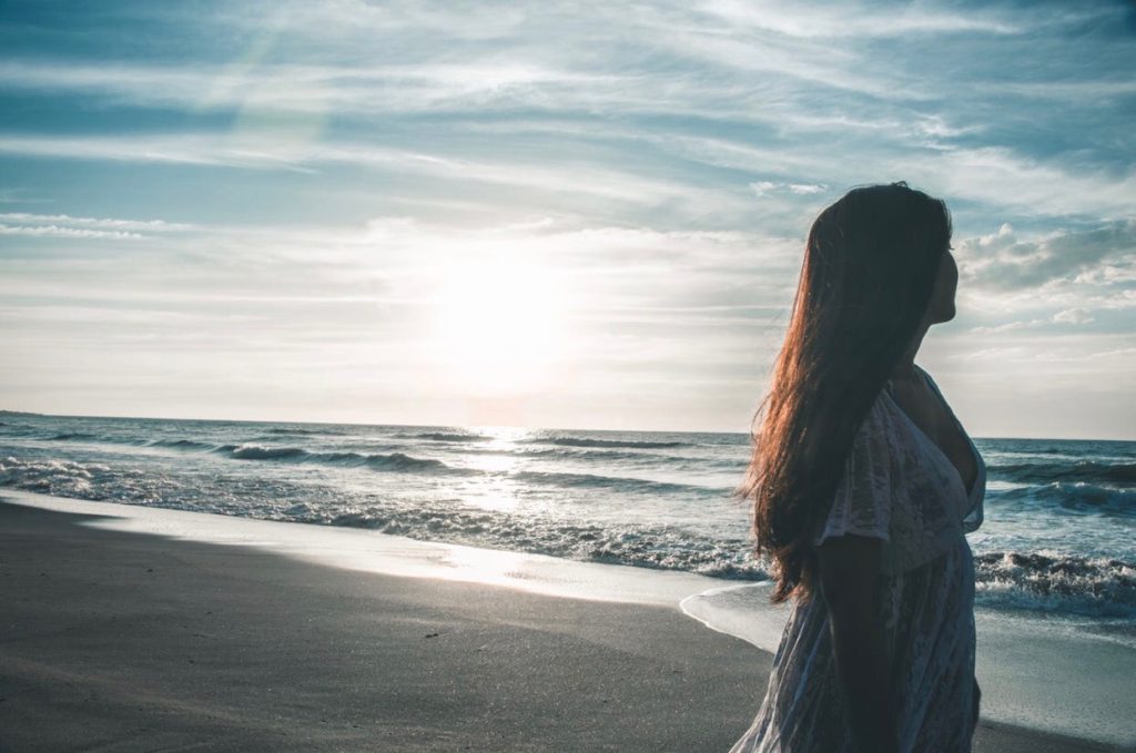 Girl with long hair on the beach