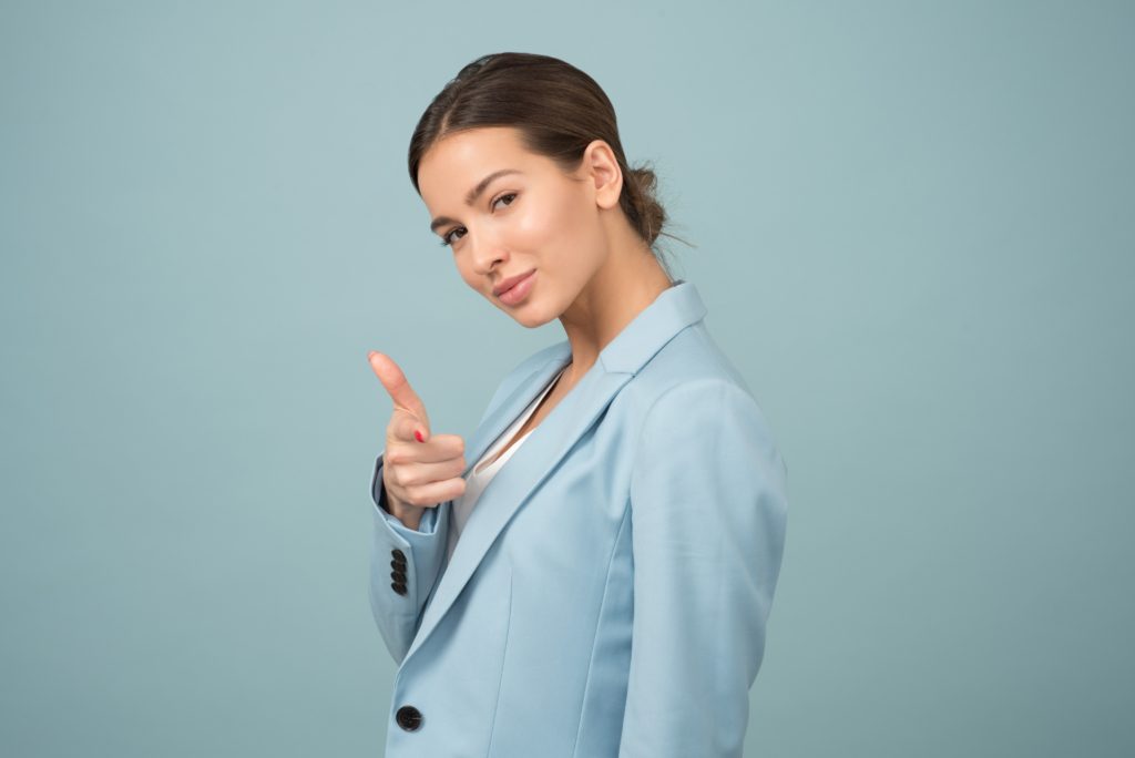 girl with the bun, pointing a finger